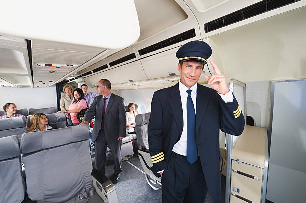 istock Flight captain standing on airplane saluting 528955775
