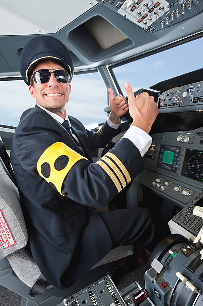 istock Senior flight captain with thumbs up in airplane cockpit 528955819