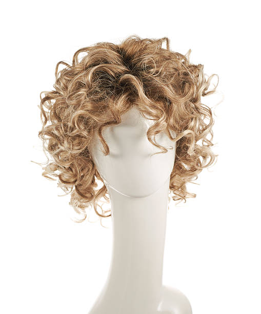 Hair wig over the mannequin head Curly hair wig over the white plastic mannequin head isolated over the white background ringlet stock pictures, royalty-free photos & images