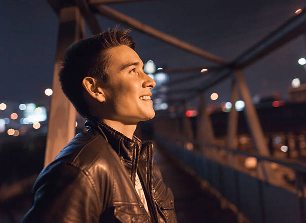 Young male smiling in the city.