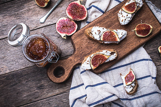 istock rustic style tasty Bruschetta with jam and figs on napkin 528957729