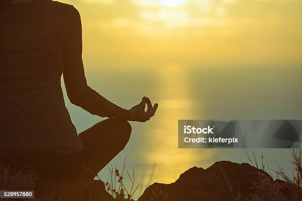 Peaceful Yoga By The Sea Stock Photo - Download Image Now - Indoors, Sunrise - Dawn, Yoga