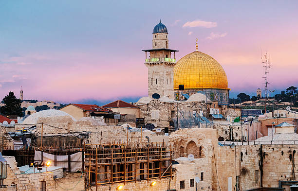 Dome of the Rock, Qubbat Al-Sakhrah, Jerusalem, Israel The Dome of the Rock in sunset with vibrant colors, is now one of the oldest works of Islamic architecture.It is famous as Jerusalem's most recognizable landmark. east jerusalem stock pictures, royalty-free photos & images