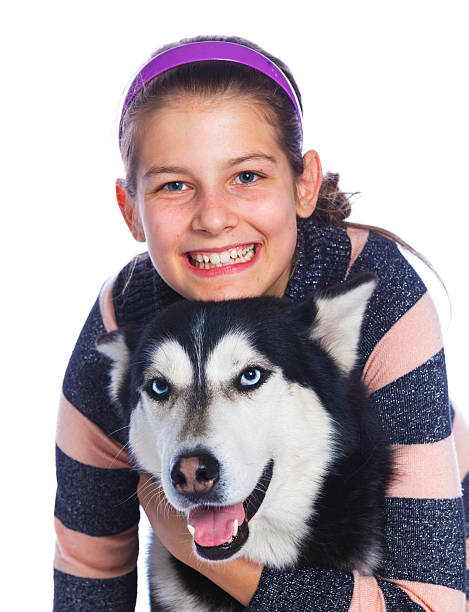 istock Girl is with her dog husky 528958812