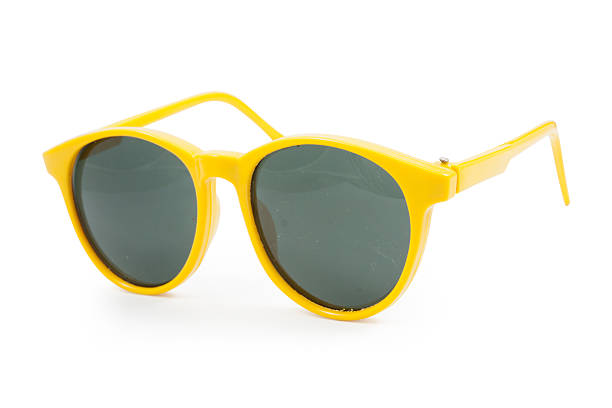istock Yellow sunglasses on white background 528958831