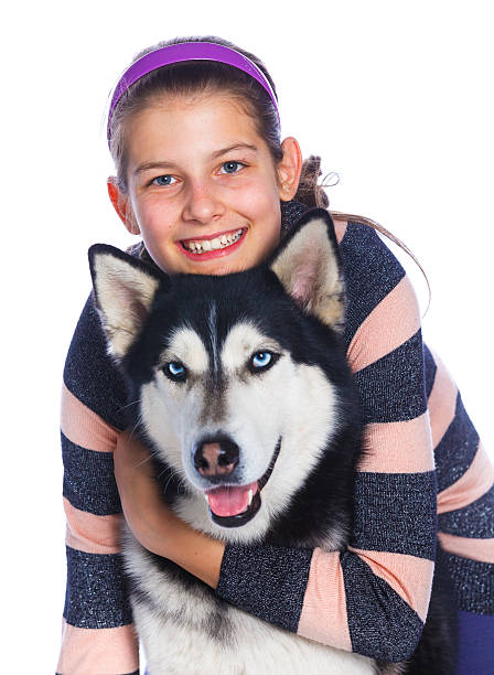 istock Girl is with her dog husky 528958862
