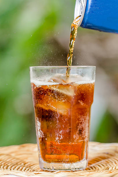 istock glass of cola with ice 528960027