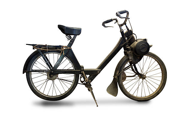Old black motorcycle with one cylinder standing on the street