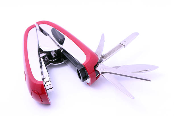 istock multifunctional Office Swiss army knife with scissors and stapler 528960979