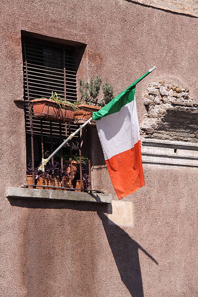 istock Italian flag hanging out of window 528963610