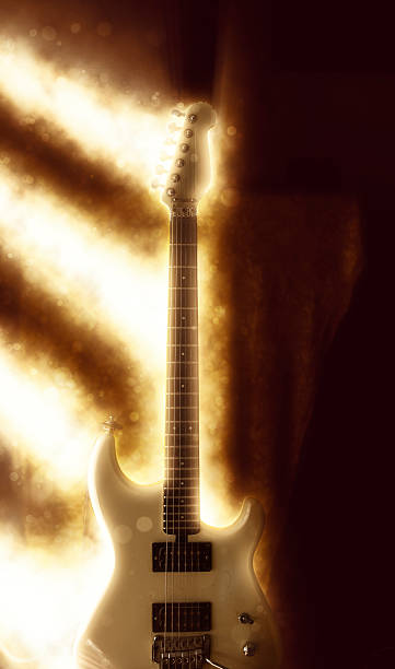 istock golden light beams on guitar 528965550