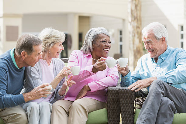 istock Multiracial senior friends outdoors drinking coffee 528968612