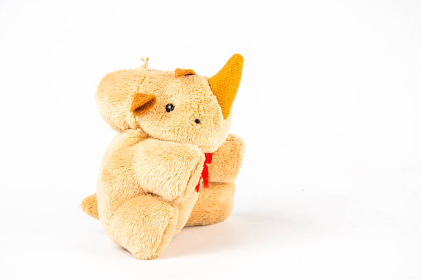 istock Rhinoceros doll on white background 528970822
