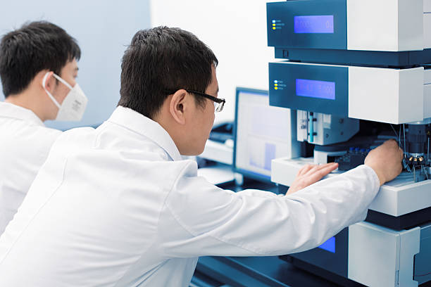 istock Two young researchers carrying out experiments in a lab 528971880