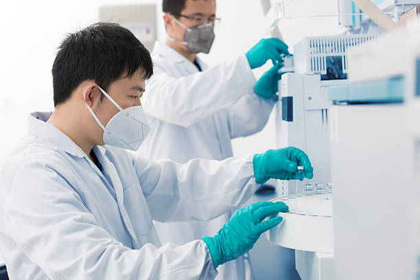 istock Two young researchers carrying out experiments in a lab 528971938
