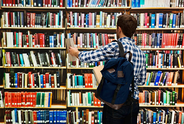 istock Rear view of student in library 528974800