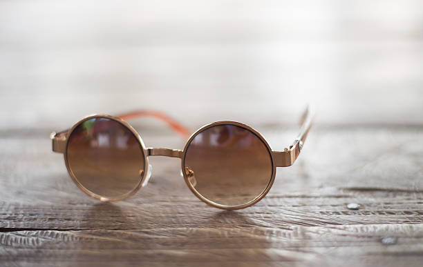 istock Vintage round eyeglasses on old wood 528976984