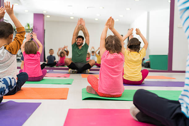 istock Stretching exercises on children's sports training. 528977532