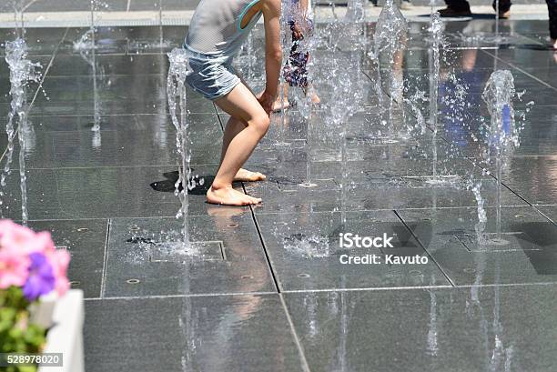 Children Playing At Fountain In A Public Park Stock Photo - Download Image Now - Activity, Baby - Human Age, Beautiful People