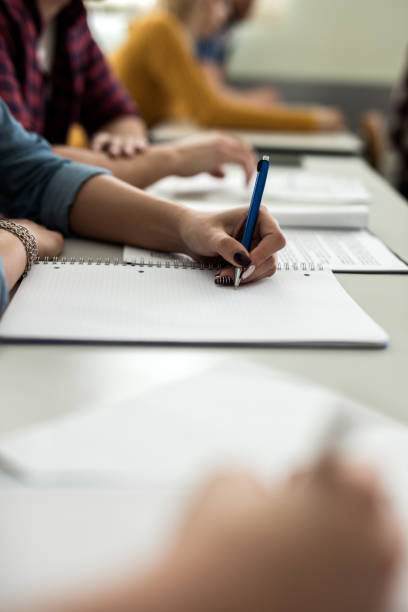 istock Close-up of student taking notes on the paper. 528978640