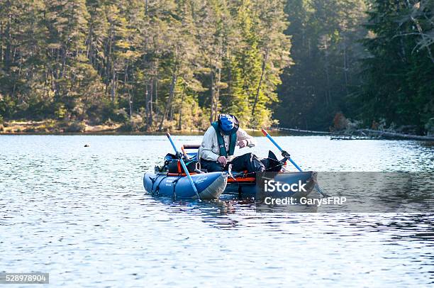 Man Trout Fishing On Cleawox Lake In Inflatable Pontoon Boat Stock Photo -  Download Image Now - iStock