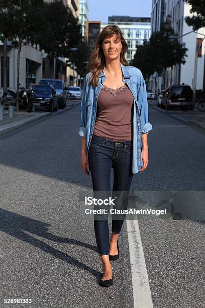 Happy Young Woman Stock Photo - Download Image Now - Jeans, Slim, Adult