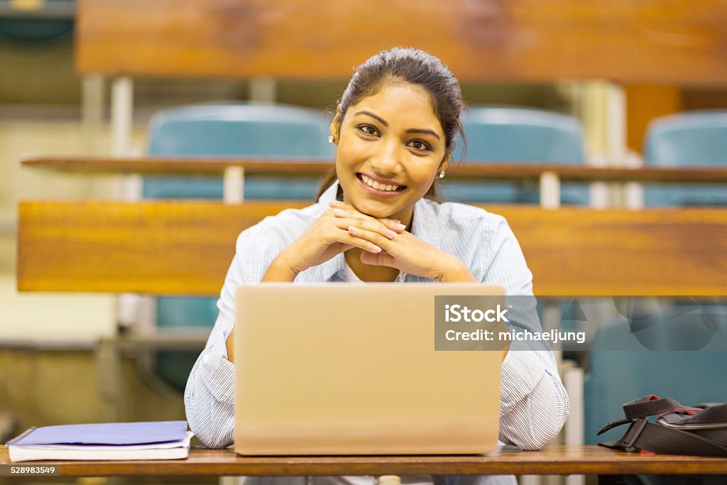 cute indian college student in lecture room portrait of cute indian college student in lecture room Adult Stock Photo