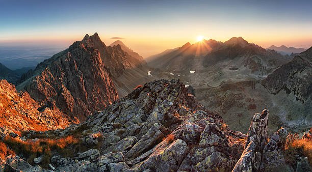 istock Mountain panorama with sun in Slovakia 528983730