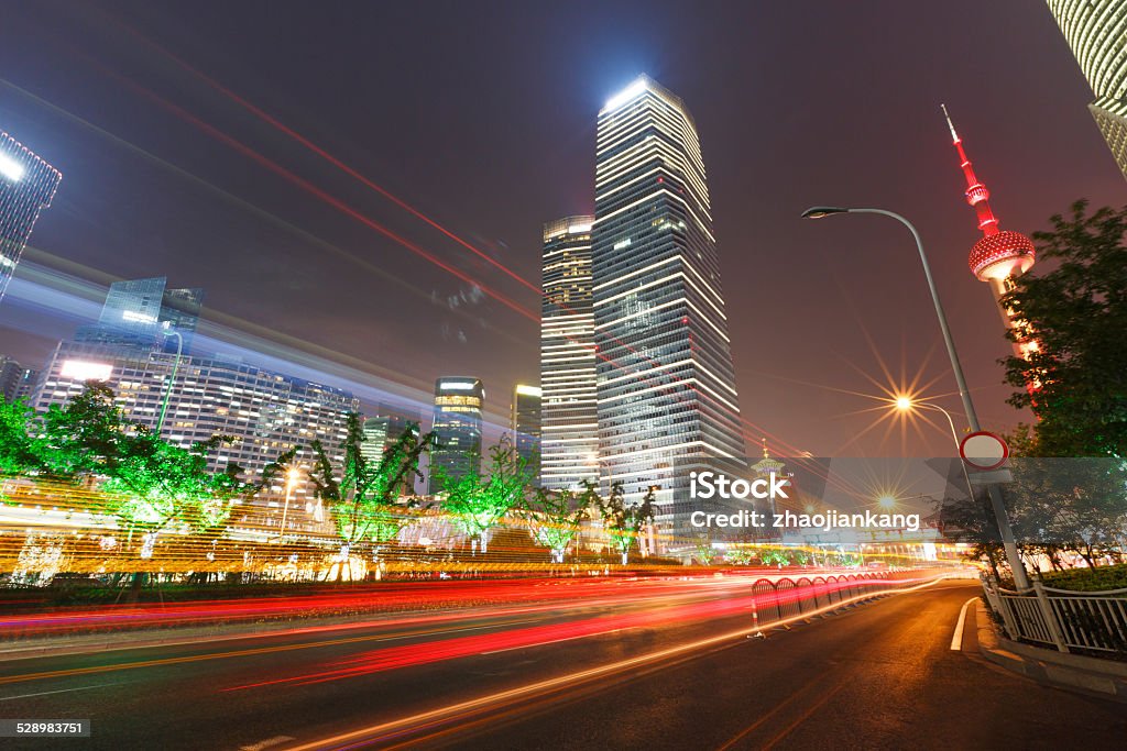 the light trails on the modern building background in shanghai the light trails on the modern building background in shanghai，China Abstract Stock Photo