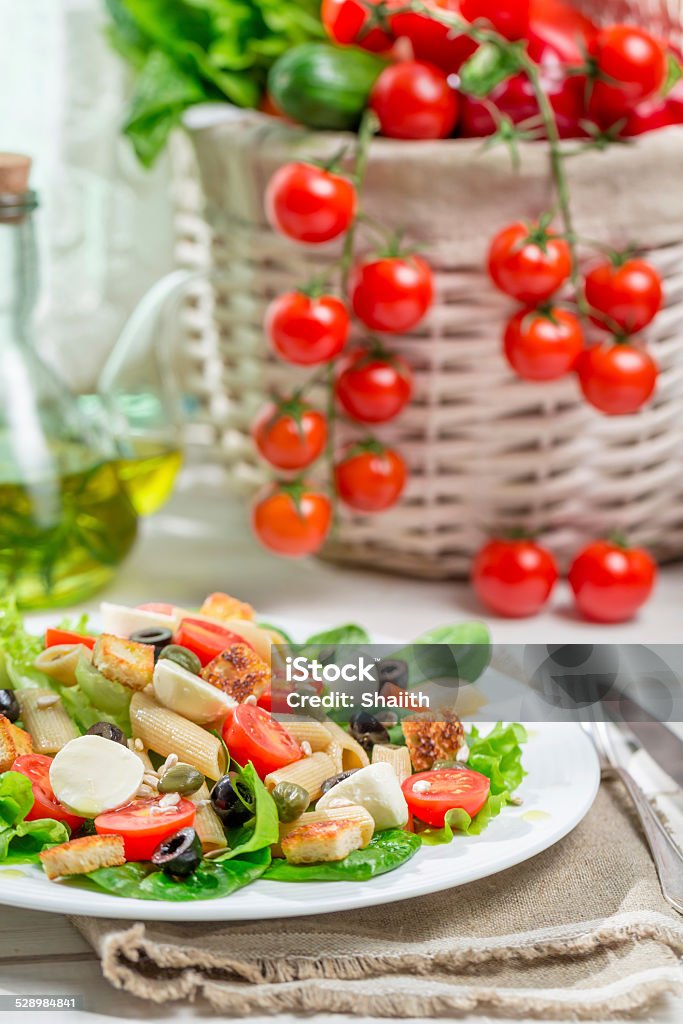 Healthy salad with vegetables, pasta and croutons Healthy salad with vegetables, pasta and croutons. Appetizer Stock Photo