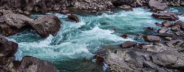 Mountain river among the stone shores