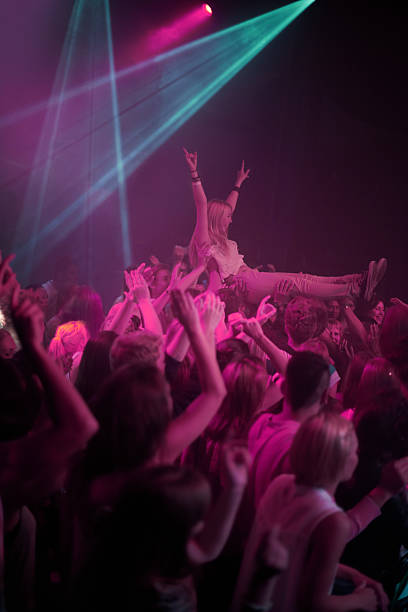 Carried by an awesome crowd! A stage diver being carried across the audience at a rock concerthttp://195.154.178.81/DATA/shoots/ic_782718.jpg dubstep photos stock pictures, royalty-free photos & images