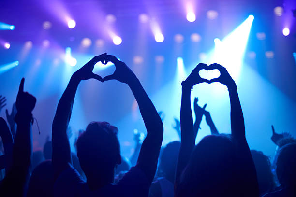 Showing their love Shot of adoring fans at a rock concert dubstep photos stock pictures, royalty-free photos & images