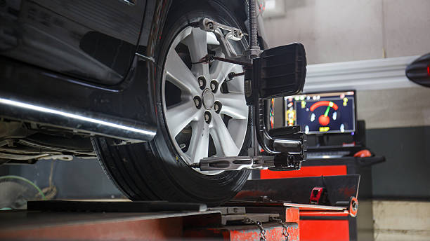wheels alignment camber Car on stand with sensors on wheels for wheels alignment camber check in workshop of Service station. order stock pictures, royalty-free photos & images