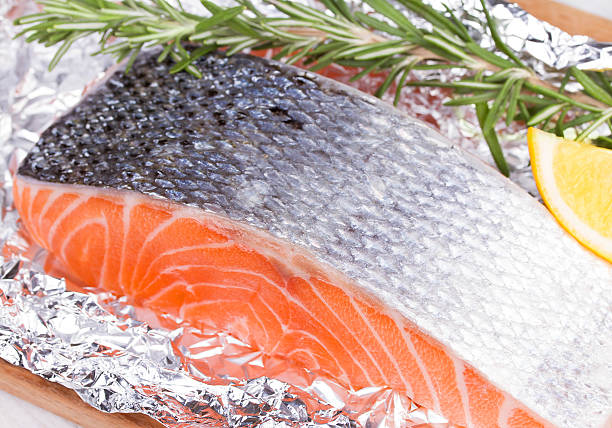istock Fresh salmon ready for cooking on the foil paper 529003763