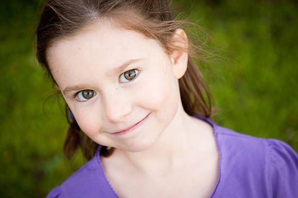 istock Happy Little Girl Smiling Outside 529004565