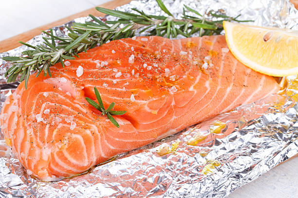 istock Fresh salmon ready for cooking on the foil paper 529004883