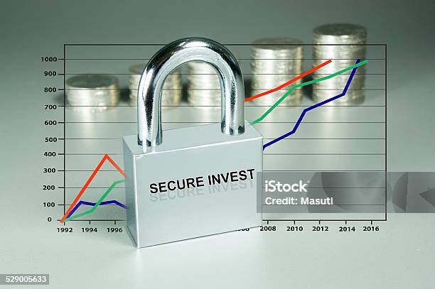 Padlock Graph And Coins In The Background Stock Photo - Download Image Now - Business, Coin, Coin Bank