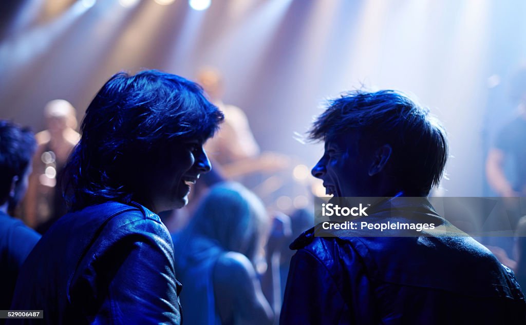 This band is amazing! Shot of fans enjoying a rock show Adult Stock Photo