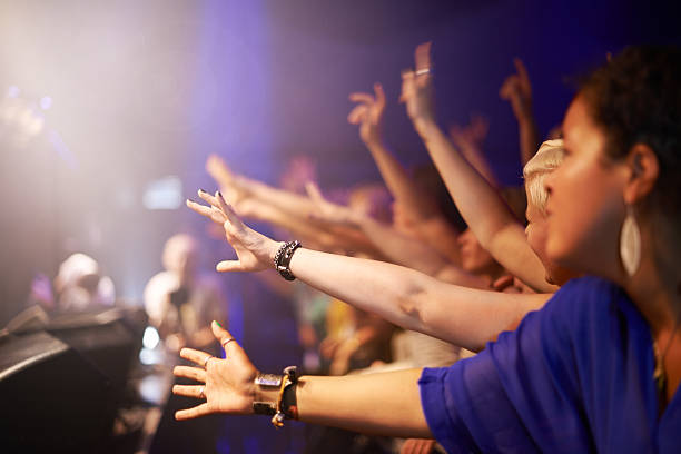 istock Reaching out for their favourite band 529006501