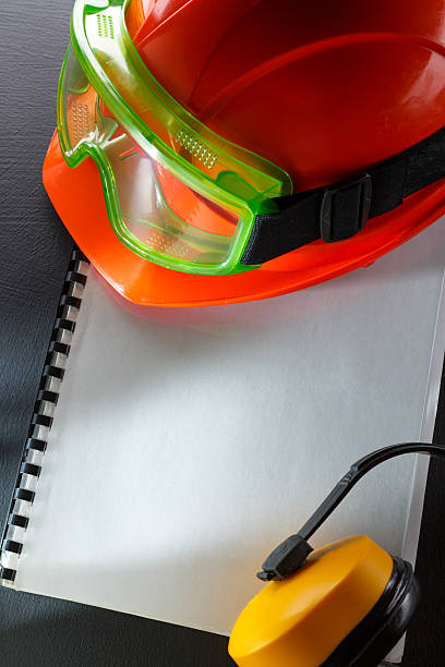 istock Goggles, earphones and red helmet 529007343