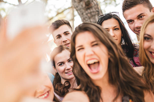 istock Group of college student laughing and doing a selfie 529008187
