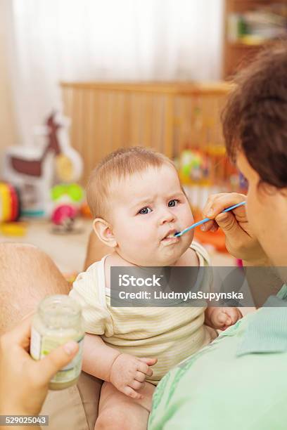 Father Feeding His Cheerful Baby Stock Photo - Download Image Now - Adult, Baby - Human Age, Baby Girls