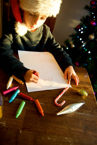 istock baby Santa write letter for Christmas 529027105
