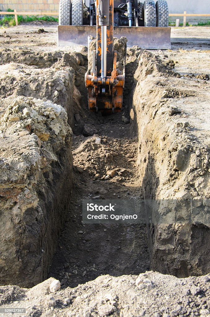 Bagger digging Backhoe Stock Photo