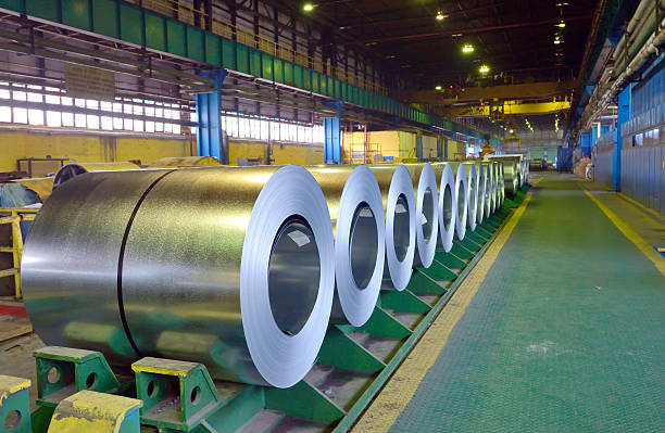 Rolls of steel sheet Rolls of steel sheet in steel pant galvanized stock pictures, royalty-free photos & images