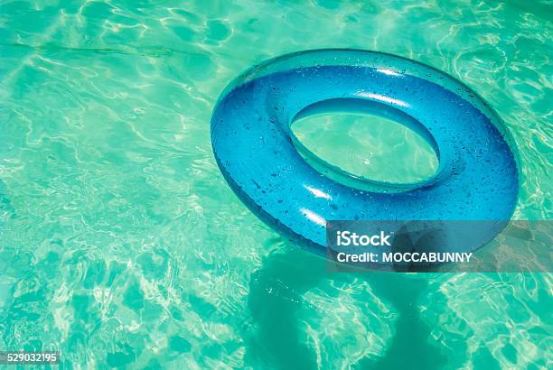 Inner Tube In Swimming Pool Stock Photo - Download Image Now - Blue, Buoy, Circle