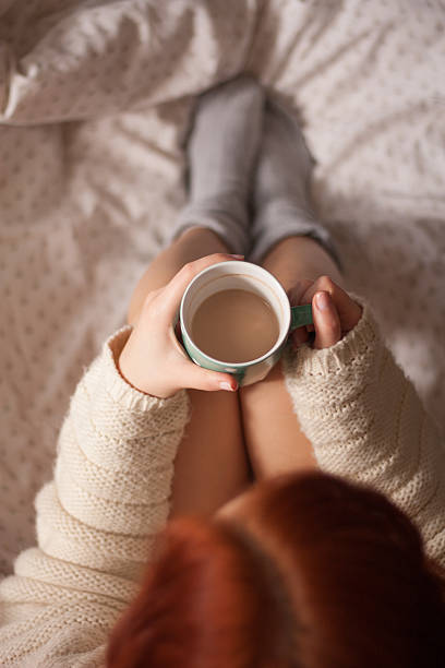 istock Young redhead woman in home interior. 529049849