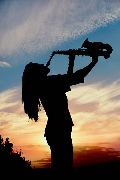istock girl playing the saxophone 529050918