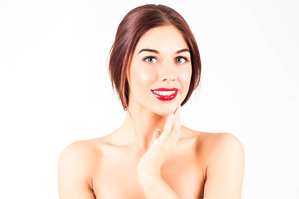 istock Sexy woman with red lips touching chin. 529050922